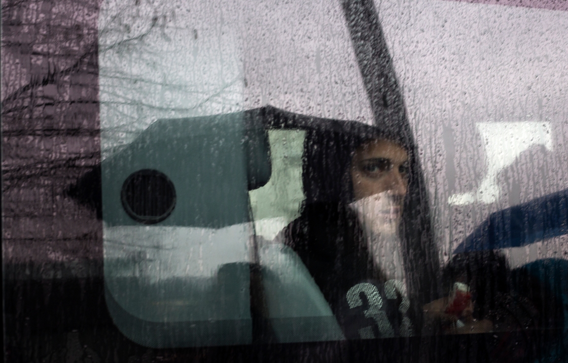 A man sits in a car on a rainy day in Budapest, Hungary.